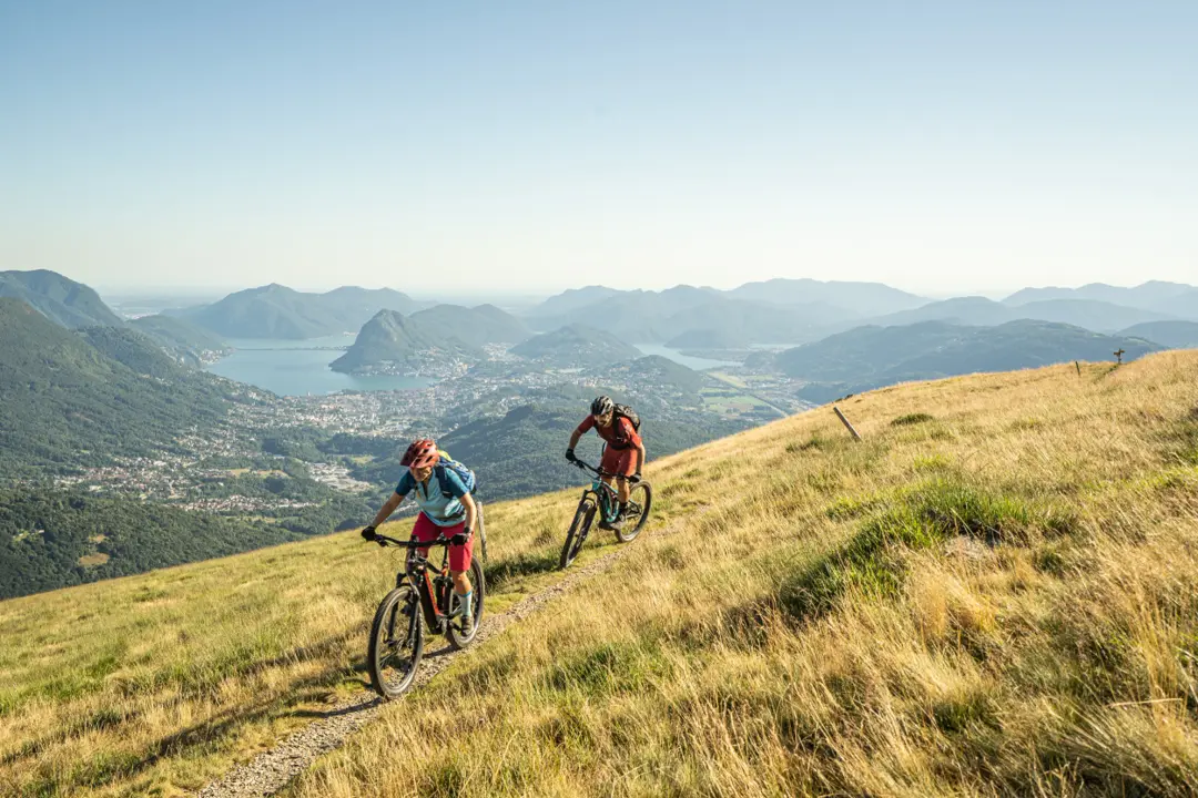 Mountain biker on an autumn trail high above Zurich
